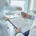 https://www.pexels.com/photo/doctor-handing-a-document-8413294/